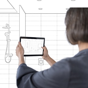 Businesswoman taking photo of empty office space